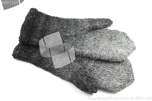 Image of wool gray knitted mittens on a white