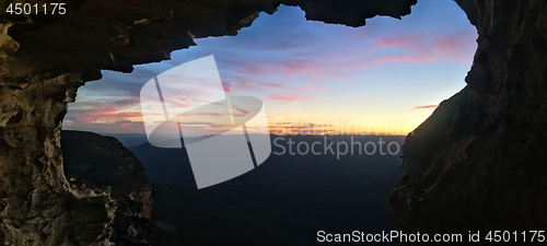 Image of Mountain views to sunset from inside cliff cave