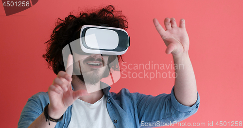 Image of young man using VR headset glasses of virtual reality