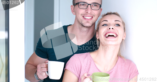 Image of young couple enjoying morning coffee