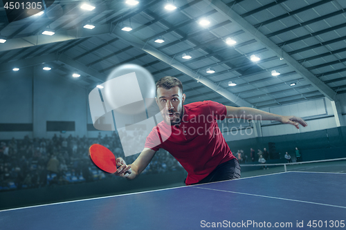 Image of The table tennis player serving