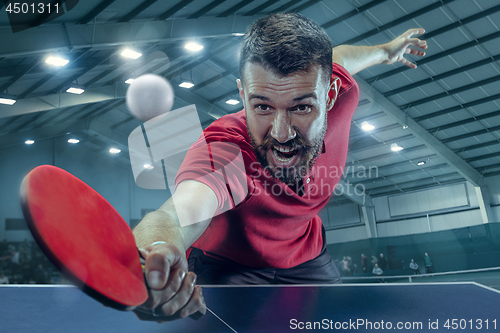 Image of The table tennis player serving