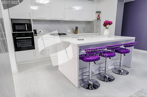 Image of white dining table in modern kitchen