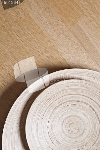 Image of Bamboo bowls on wooden background.