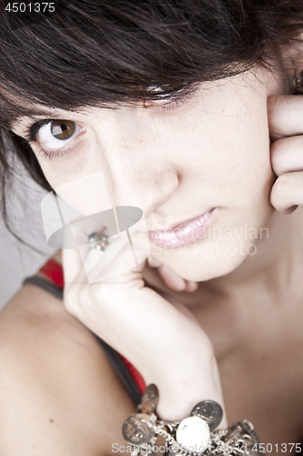 Image of Portrait of young brunet woman.