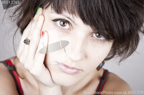 Image of Brunette lady with bracelets.