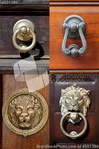 Image of Ancient italian door knockers and handles.