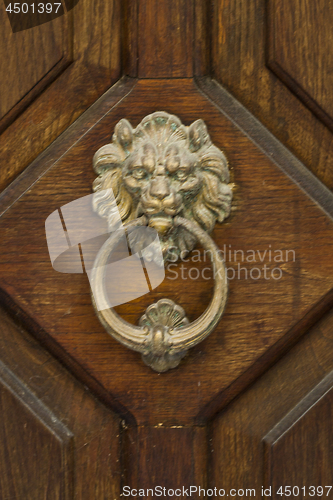 Image of Ancient italian lion shaped door knocker.