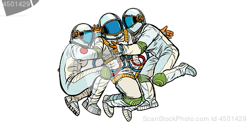 Image of three astronauts hugging