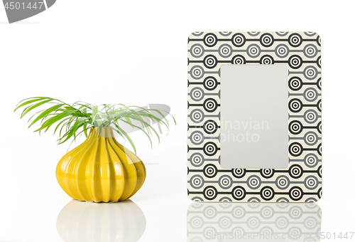 Image of Vase with palm leaves and retro style picture frame