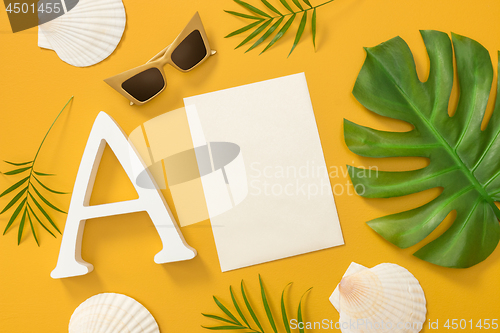 Image of Bright tropical flat lay with blank paper sheet