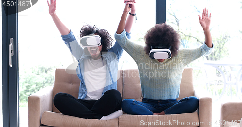 Image of Multiethnic Couple using virtual reality headset