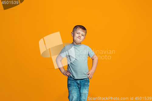 Image of Young serious thoughtful teen boy. Doubt concept.