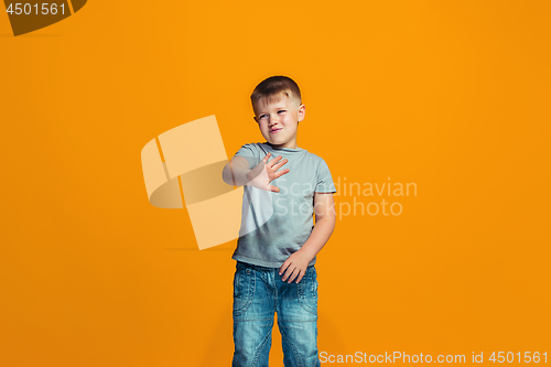 Image of Young serious thoughtful teen boy. Doubt concept.