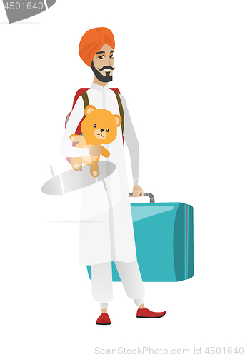 Image of Man traveling with old suitcase and teddy bear.