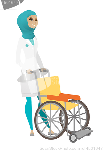 Image of Muslim female doctor pushing wheelchair isolated on white background.
