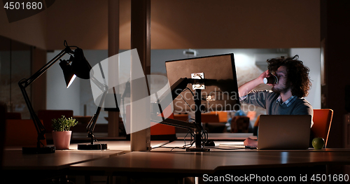 Image of Tired businessman working late