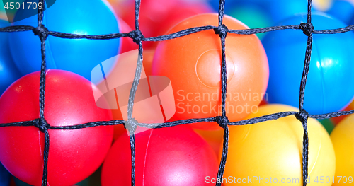 Image of Colorful plastic toy balls in the play pool