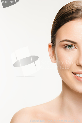 Image of Beautiful face of young adult woman with clean fresh skin isolated on white