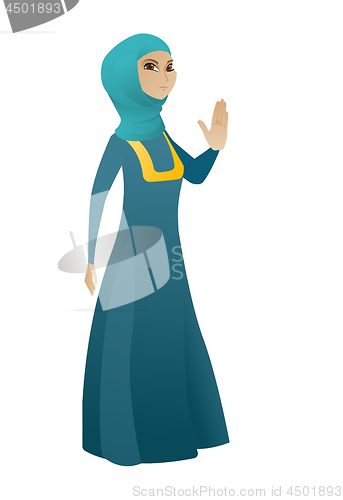Image of Muslim business woman showing palm hand.