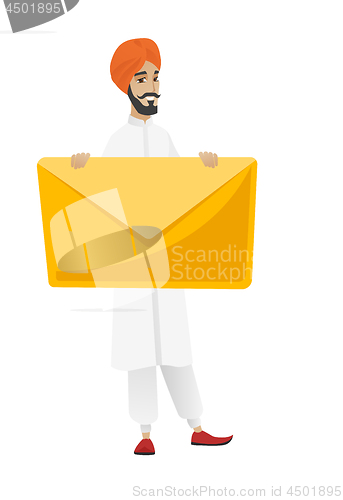 Image of Smiling businessman holding a big envelope.