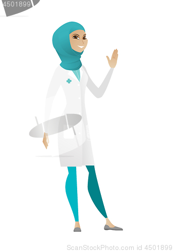 Image of Young muslim doctor waving her hand.