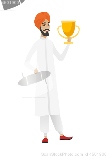 Image of Hindu businessman holding a trophy.