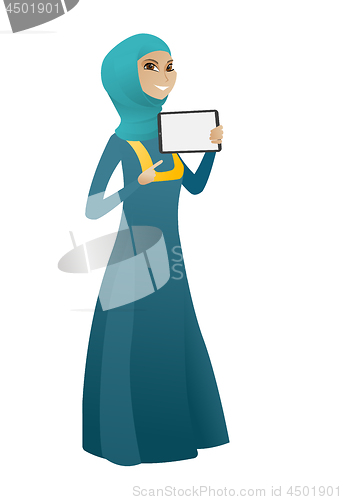 Image of Smiling business woman holding tablet computer.