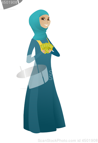 Image of Happy muslim business woman holding money.
