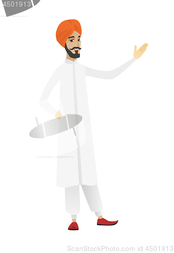 Image of Hindu businessman showing a direction.