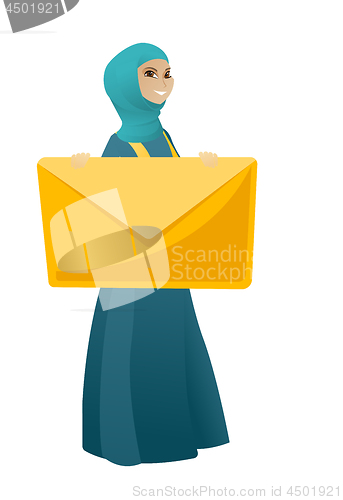 Image of Smiling business woman holding a big envelope.