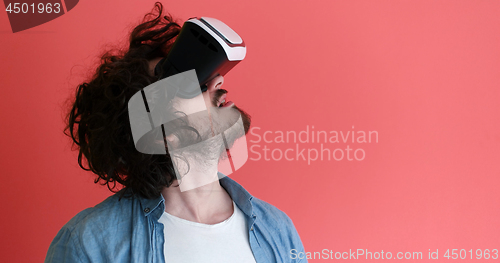 Image of young man using VR headset glasses of virtual reality
