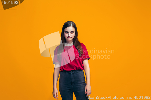 Image of Young serious thoughtful teen girl. Doubt concept.