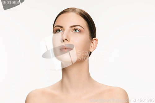 Image of Beautiful face of young adult woman with clean fresh skin isolated on white