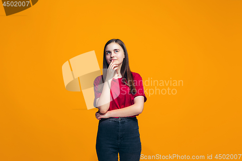 Image of Young serious thoughtful teen girl. Doubt concept.