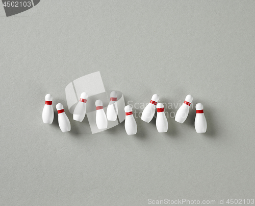 Image of bowling pins on grey background