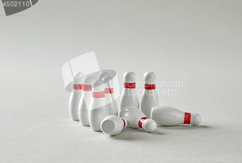 Image of bowling pins on grey background