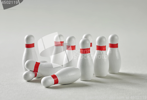 Image of bowling pins on grey background