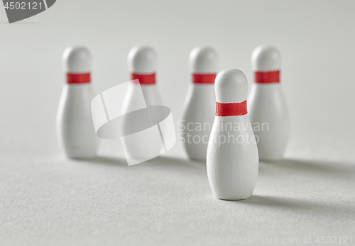 Image of bowling pins on grey background