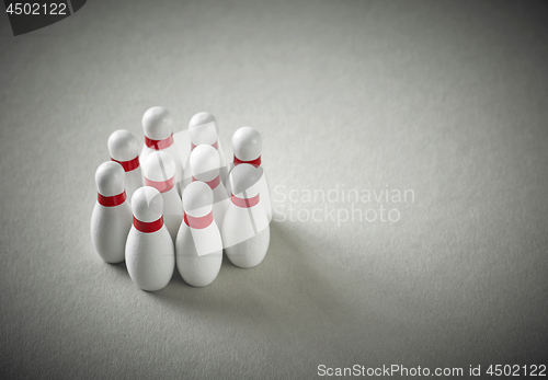 Image of bowling pins on grey background