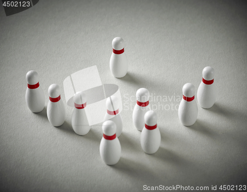 Image of bowling pins on grey background