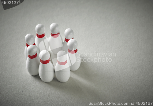 Image of bowling pins on grey background