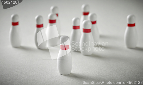Image of bowling pins on grey background