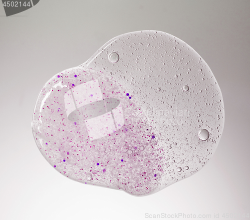 Image of cosmetic scrub gel and liquid