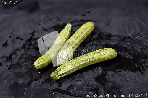 Image of Fresh green wet zucchini.