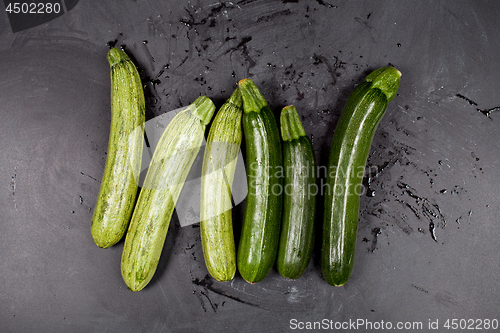 Image of Fresh green wet zucchini.