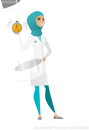 Image of Muslim doctor holding alarm clock.