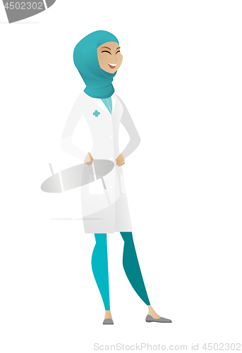 Image of Muslim doctor in medical gown laughing.
