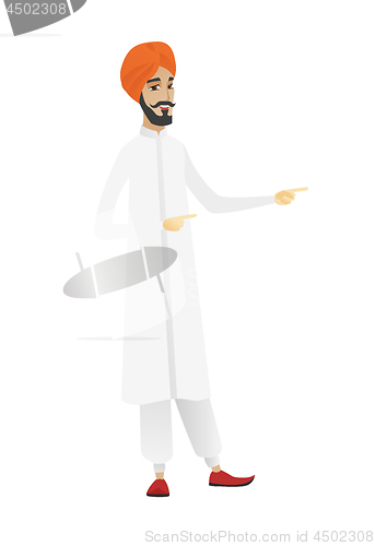 Image of Hindu businessman pointing to the side.