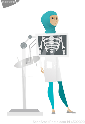 Image of Muslim roentgenologist during x ray procedure.